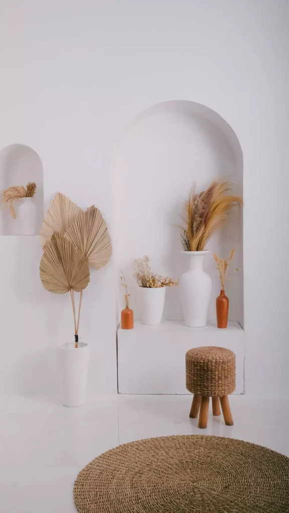 White Wall Arch Styled With Dried Pampas Grass And Ceramic Vases