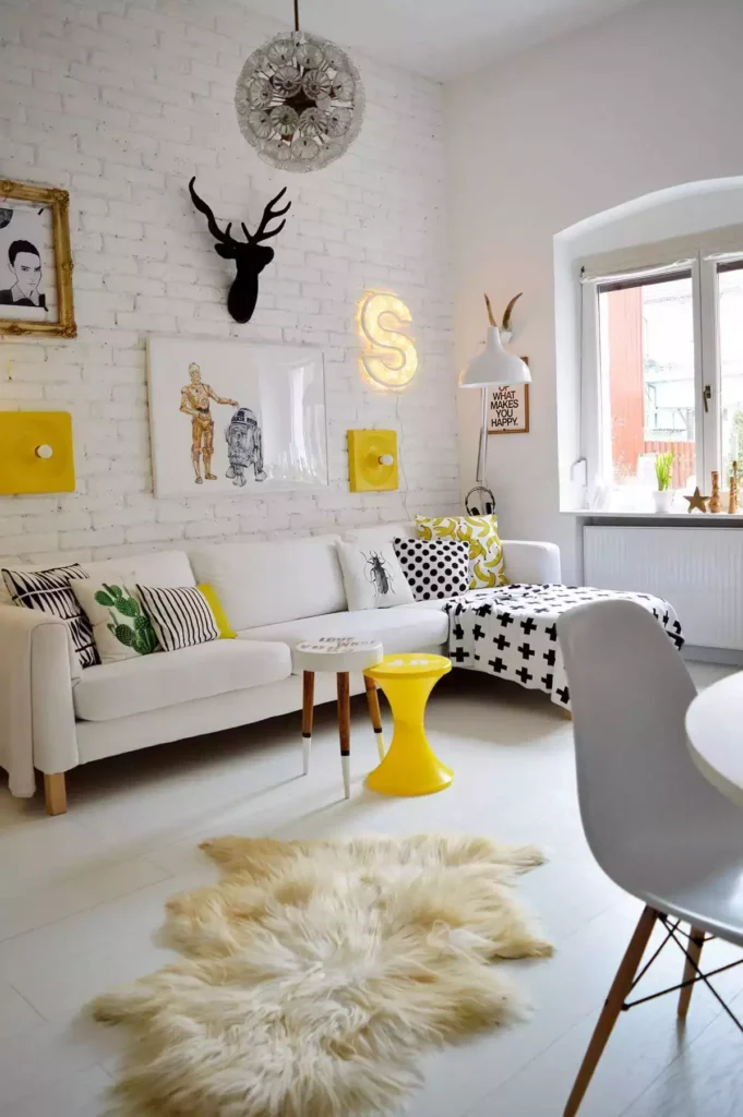 White brick wall lounge, neon S, yellow stool, sheepskin, pop-art pillows