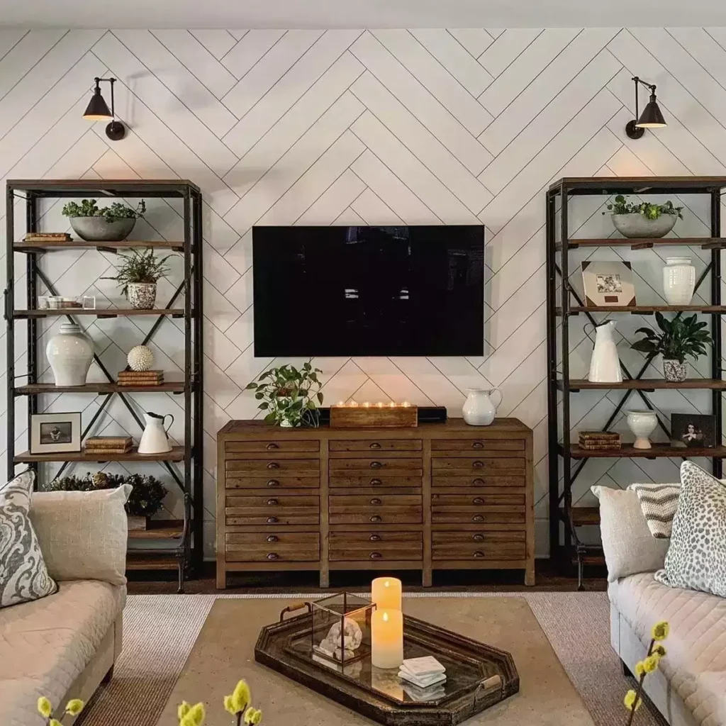 White herringbone accent wall, iron shelves, apothecary chest, black sconces