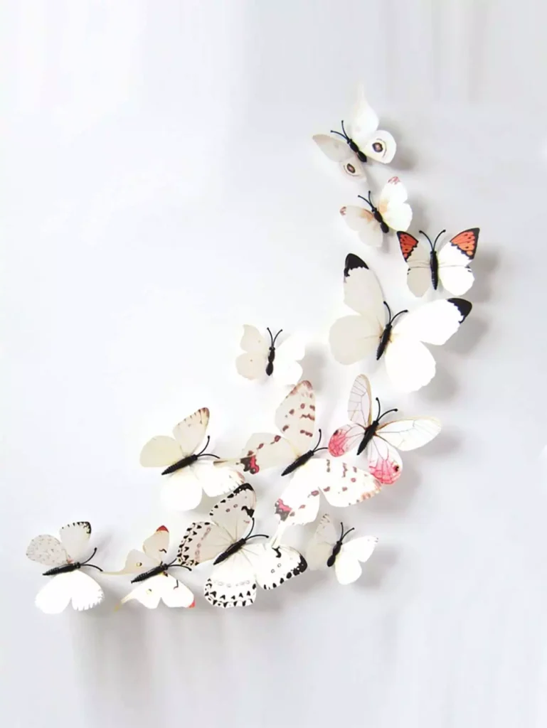 White ombré 3D butterflies drifting across a plain Butterfly Wall backdrop