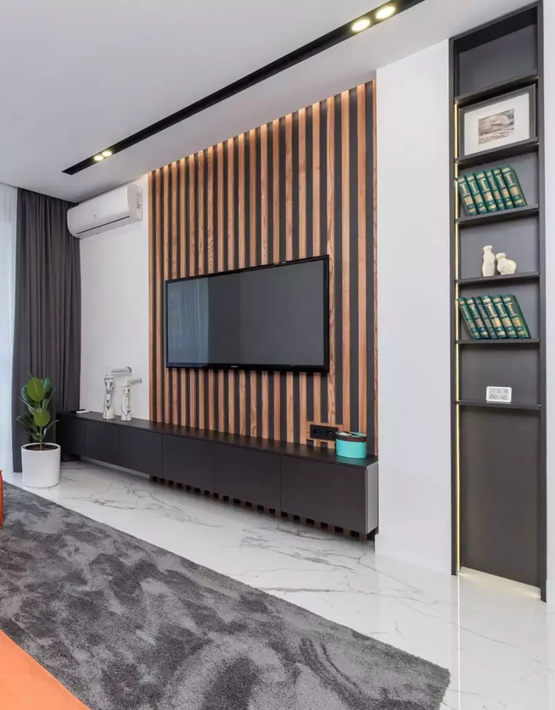 Wood Slat TV Wall With Matching Dark Console And Backlit Display Niche