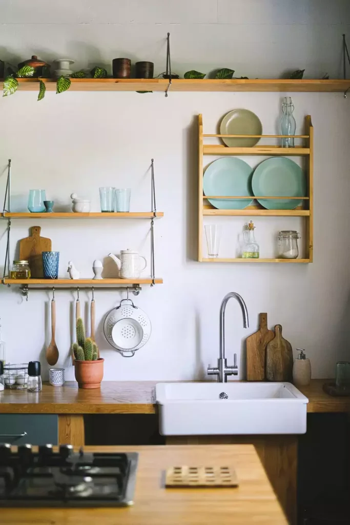Wooden Plate Rack And Hanging Shelves Bring Light Kitchen Wall Decor Above A Farmhouse Sink