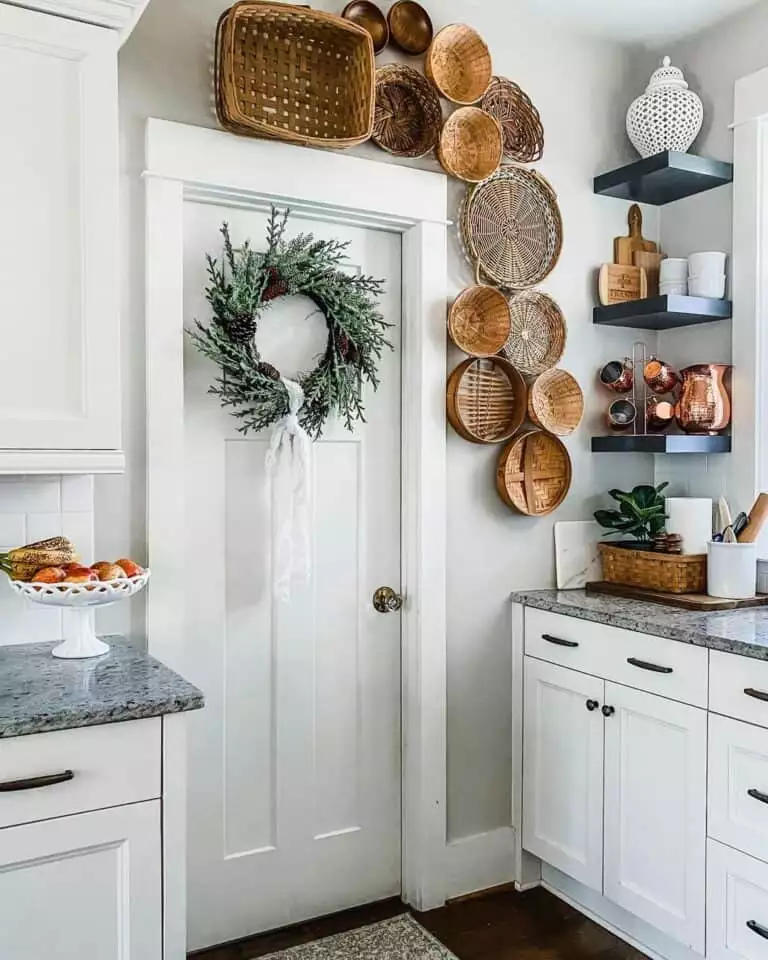 Woven basket cluster surrounding a kitchen door on the kitchen wall