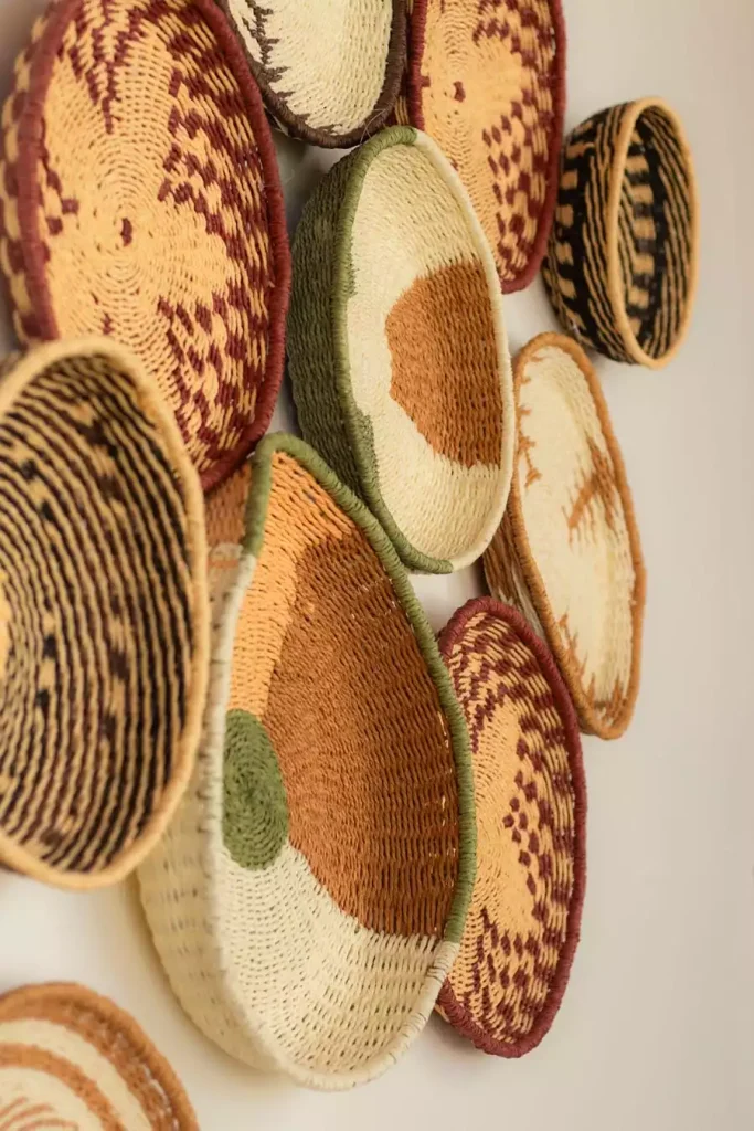 Close up colorful patterned woven basket wall decor
