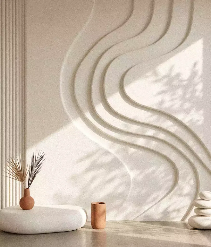 Flowing raised lines and vertical fluting on a white wall above a styled console