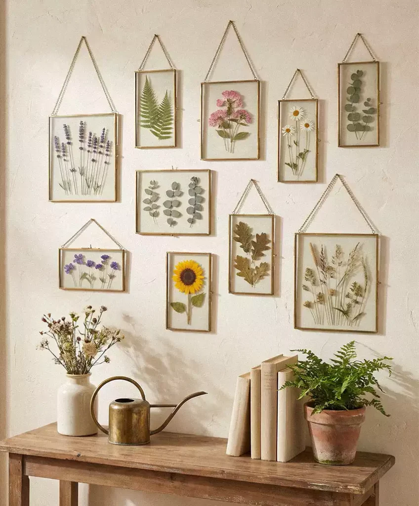 Framed botanical gallery wall above a wooden console