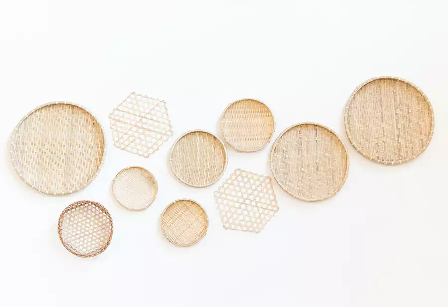 Pale woven trays and hexagonal cane wall panels