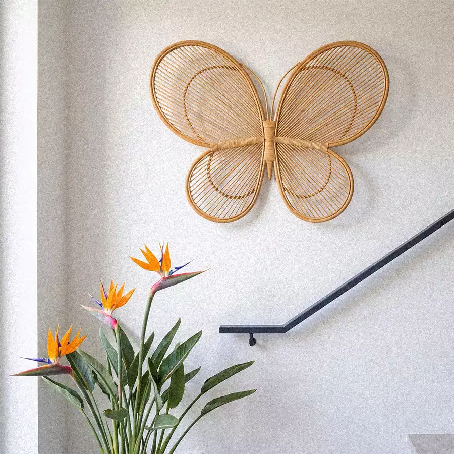 Rattan butterfly wall decor with bird of paradise flowers