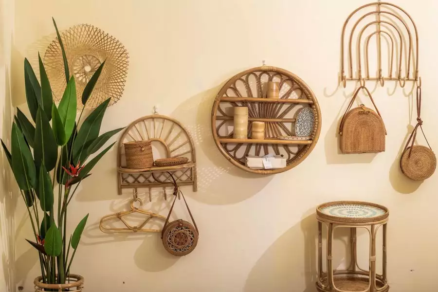 Rattan wall shelves and arched hook rack with woven bags